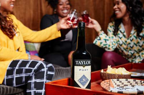Taylor Port, a sweet and delicious wine, being enjoyed by friends. Taylor Port, a sweet and delicious wine, being enjoyed by friends.