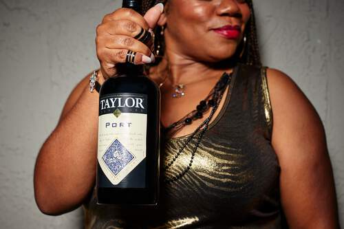 Woman holding bottle of Taylor Port